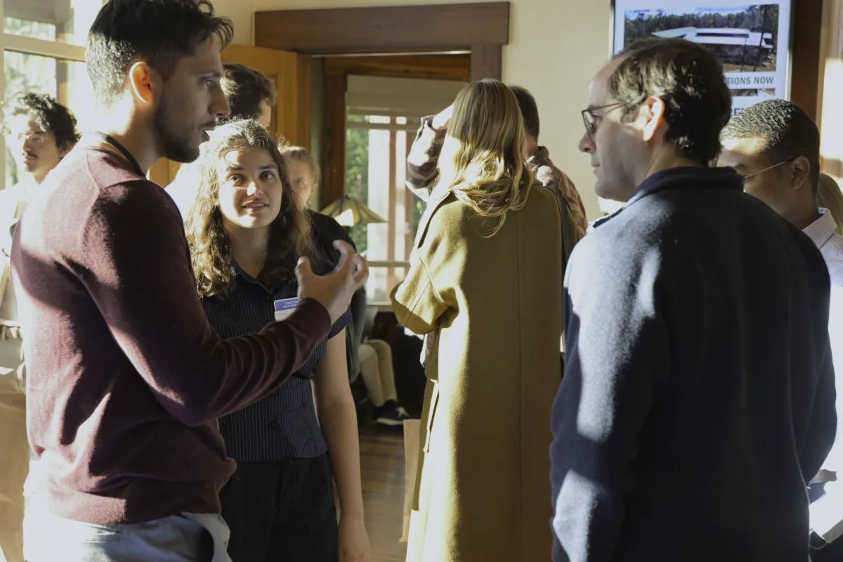 2026 CCS Summit attendees chat during a coffee break.